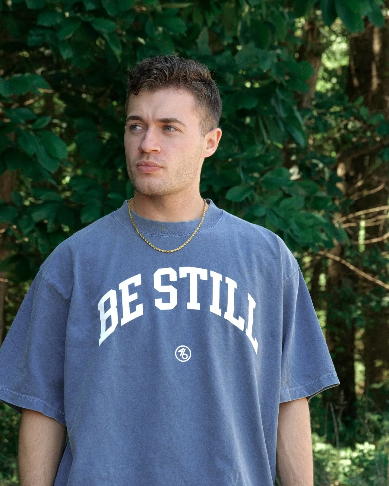 BE STILL University Style Heavy Tee