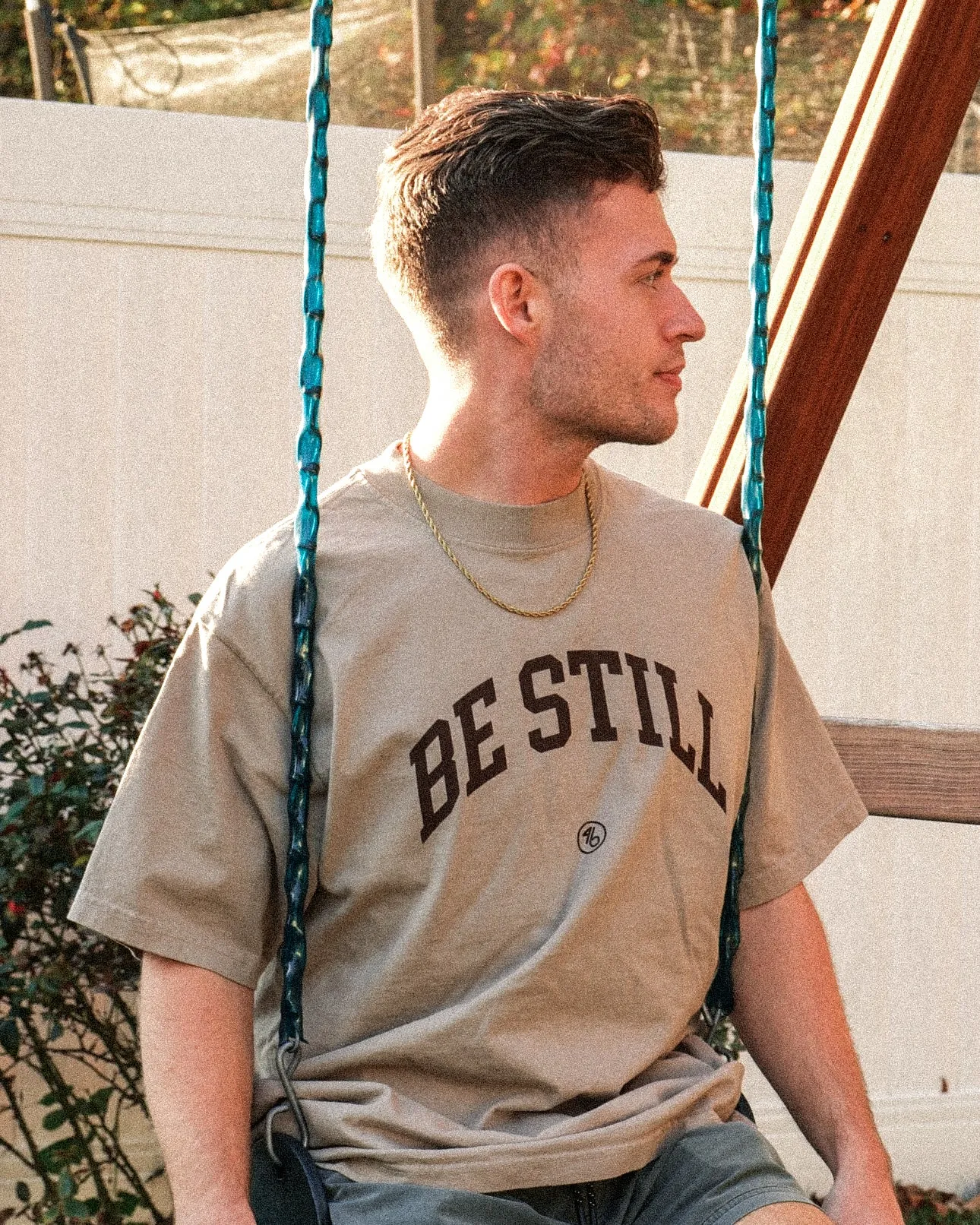 BE STILL University Style Heavy Tee