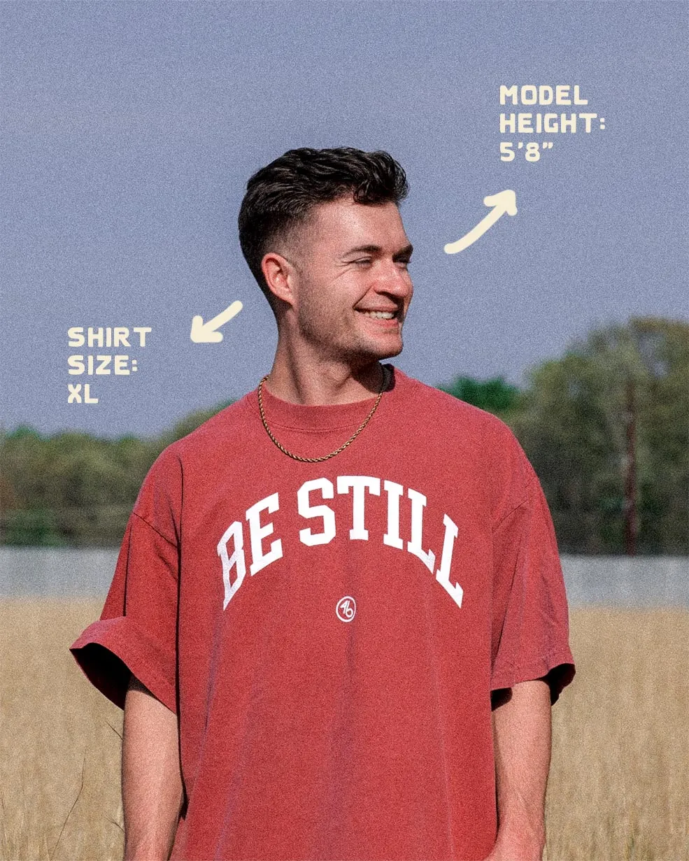 BE STILL University Style Heavy Tee